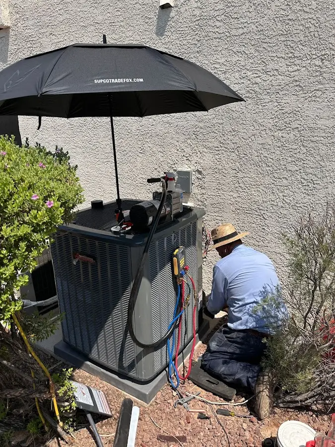 HVAC technician performing outdoor AC maintenance in Seattle